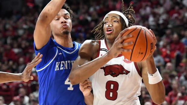 Razorbacks Chandler Lawson drives against Kentucky